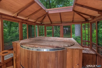 Set gracefully on a beautifully landscaped property framed by - photo 34