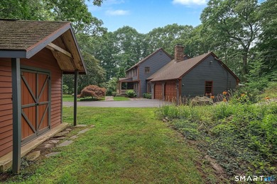 Set gracefully on a beautifully landscaped property framed by - photo 36