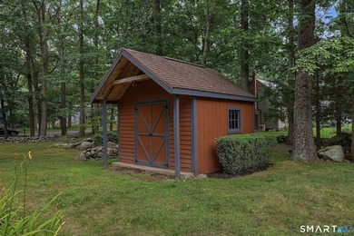 Set gracefully on a beautifully landscaped property framed by - photo 37