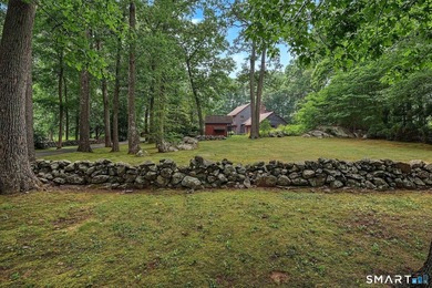Set gracefully on a beautifully landscaped property framed by - photo 38
