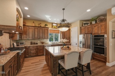 Overlooking the 13th tee in Tetherow, this exceptional home - photo 9