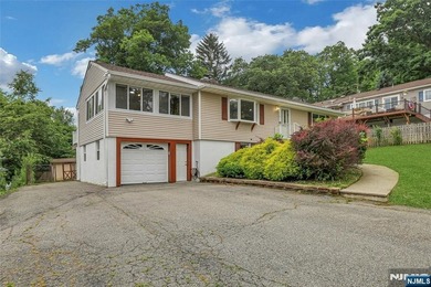 This beautiful raised ranch offers a great location with - photo 1