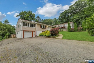 This beautiful raised ranch offers a great location with - photo 2