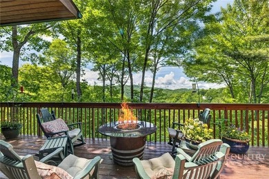 Magnificent home embraced by rhododendrons and hardwood trees - photo 12
