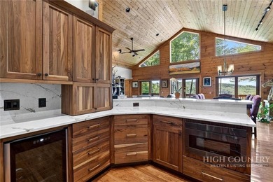 Magnificent home embraced by rhododendrons and hardwood trees - photo 19