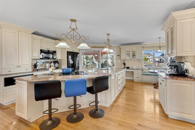 This spectacular expanded ranch sits on a deep waterfront lot - photo 14
