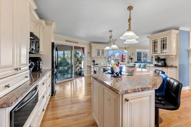 This spectacular expanded ranch sits on a deep waterfront lot - photo 16