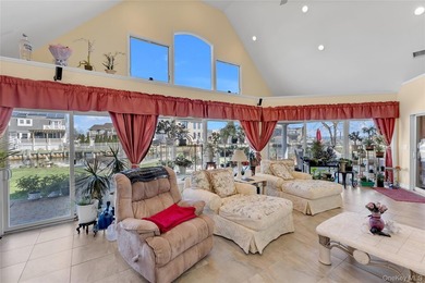 This spectacular expanded ranch sits on a deep waterfront lot - photo 23