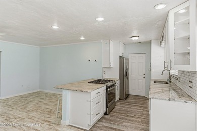 Embrace the ultimate beachside lifestyle in this beautifully - photo 11