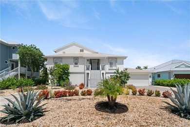 This charming 3-bedroom, 2-bathroom island-style waterfront home - photo 1