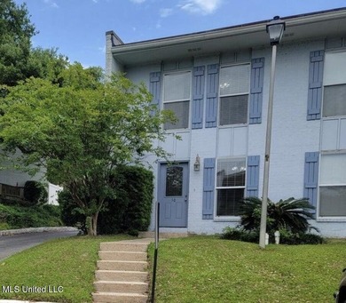 This charming 2 bedroom, 1.5 bath end unit condo is ideally - photo 1
