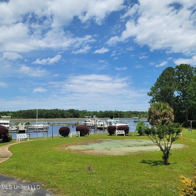 This charming 2 bedroom, 1.5 bath end unit condo is ideally - photo 2