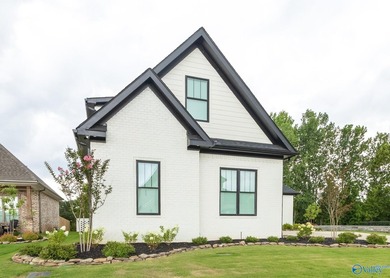 This beautifully designed 4-bedroom home features an open floor - photo 3