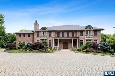 MAJESTICALLY SET ON 2 MANICURED ACRES, THIS BRICK COLONIAL MANOR - photo 2