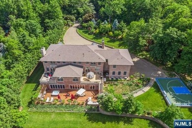 MAJESTICALLY SET ON 2 MANICURED ACRES, THIS BRICK COLONIAL MANOR - photo 4