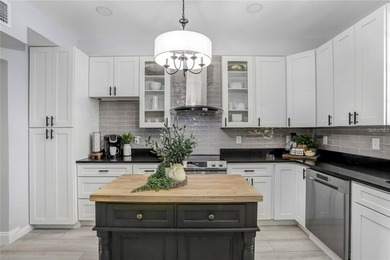 Step into this exquisitely renovated 1925 residence, where - photo 4