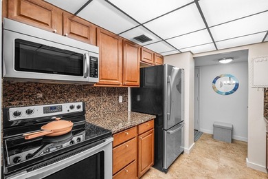 Light and bright south-facing condo just steps to the beach and - photo 11