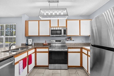 Rare opportunity to own a first-floor end-unit condo in a prime - photo 12