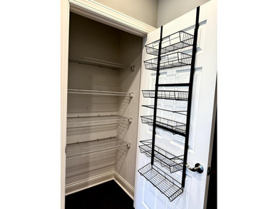 The spacious, open floor plan includes hardwood flooring, gas - photo 12