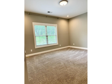 The spacious, open floor plan includes hardwood flooring, gas - photo 16