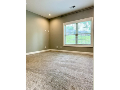 The spacious, open floor plan includes hardwood flooring, gas - photo 17