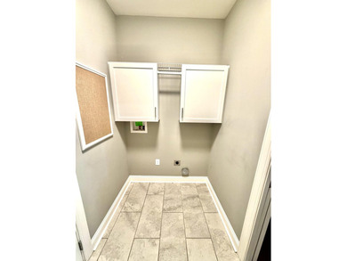 The spacious, open floor plan includes hardwood flooring, gas - photo 28
