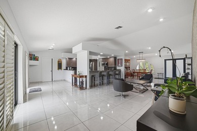 PRICE IMPROVEMENT! 4 BEDROOM + DEN HEATED POOL HOME ON A - photo 2