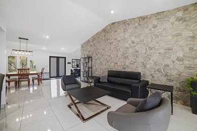 PRICE IMPROVEMENT! 4 BEDROOM + DEN HEATED POOL HOME ON A - photo 4