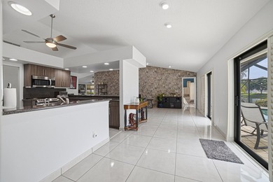 PRICE IMPROVEMENT! 4 BEDROOM + DEN HEATED POOL HOME ON A - photo 5