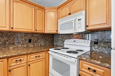 Welcome to this exceptional single-story waterfront residence - photo 12