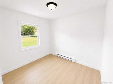 LIVING LUXURY In The Heart Of Bellport! This Ranch Style Home Is - photo 6