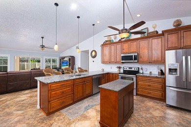 Tropical 4/2/2 pool home in desirable Southbend Lakes! This - photo 5