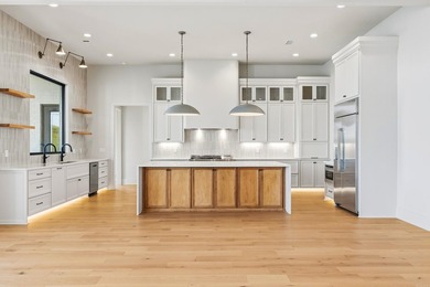 Experience luxury waterfront living in this custom new - photo 10