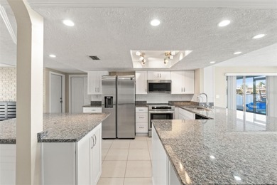 This beautifully updated Gulf Harbors waterfront home delivers