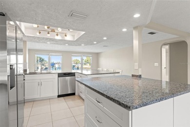 This beautifully updated Gulf Harbors waterfront home delivers