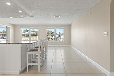 This beautifully updated Gulf Harbors waterfront home delivers