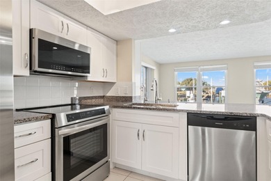 This beautifully updated Gulf Harbors waterfront home delivers