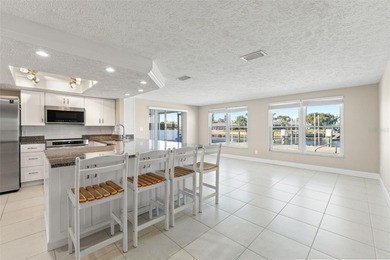 This beautifully updated Gulf Harbors waterfront home delivers