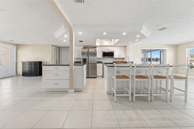 This beautifully updated Gulf Harbors waterfront home delivers