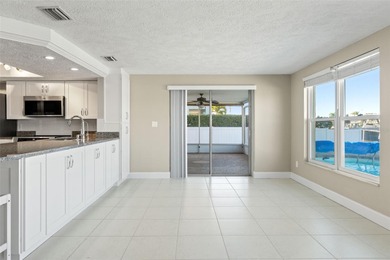 This beautifully updated Gulf Harbors waterfront home delivers