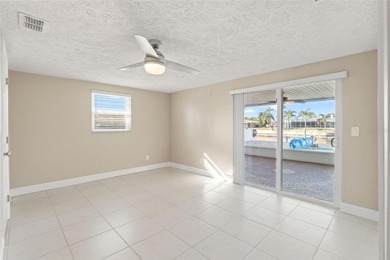 This beautifully updated Gulf Harbors waterfront home delivers