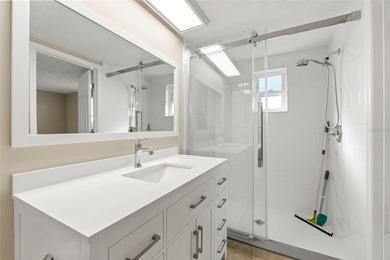 This beautifully updated Gulf Harbors waterfront home delivers