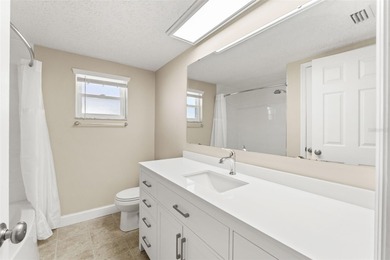 This beautifully updated Gulf Harbors waterfront home delivers