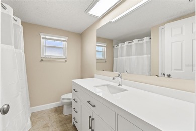 This beautifully updated Gulf Harbors waterfront home delivers