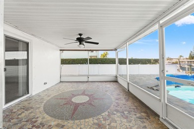 This beautifully updated Gulf Harbors waterfront home delivers