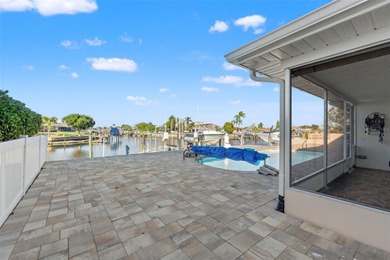 This beautifully updated Gulf Harbors waterfront home delivers