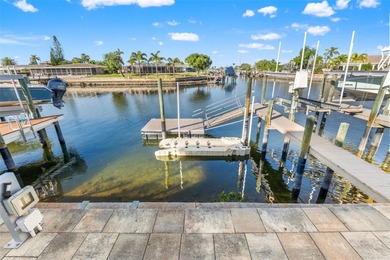 This beautifully updated Gulf Harbors waterfront home delivers