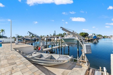 This beautifully updated Gulf Harbors waterfront home delivers