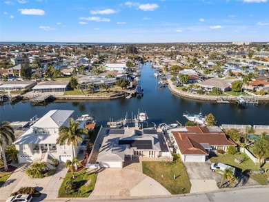 This beautifully updated Gulf Harbors waterfront home delivers