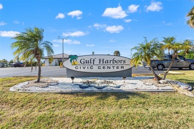 This beautifully updated Gulf Harbors waterfront home delivers